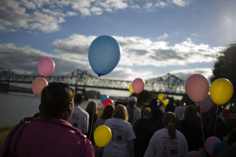 A large crowd of a few hundred people take part in a remembrance walk during the National Day of Remembrance on Sunday, Sept. 26, 2010, at the RiverPlex. The day is for grieving families and friends of people who were killed through violence.