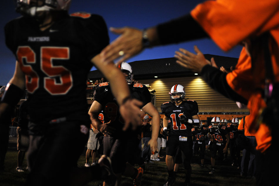 Washington wide receiver Kyle Dockery (11) and other members of the team make their way out of the locker room and onto the field for a game against Dunlap on Friday, Sept. 17, 2010, in Washington.