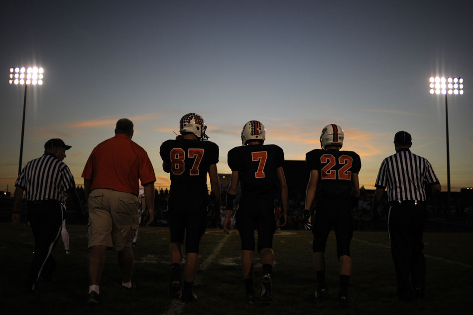 Washington team captains Connor Underwood (87), Isaac Fisher (7) and Ryan Grebner (22) walk onto the field for the coin toss before a game against Dunlap on Friday, Sept. 17, 2010, in Washington.