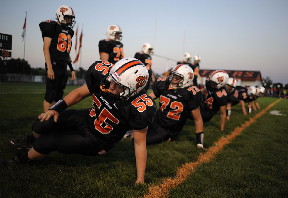 Washington's Keil Dossett (55) and the rest of the team's linemen participate in a drill before a game against Dunlap on Friday, Sept. 17, 2010, in Washington.