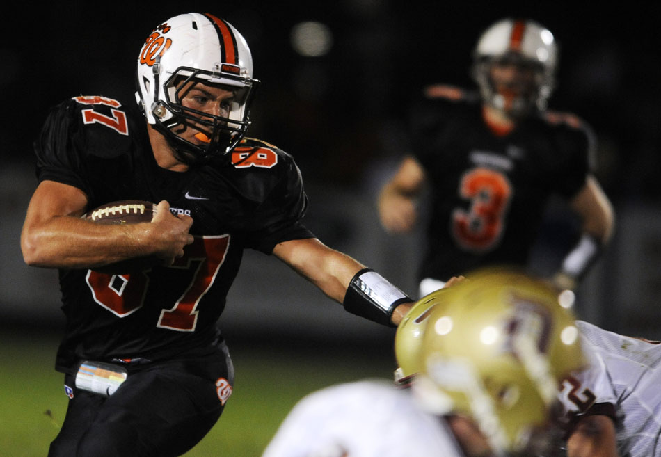 Washington's Connor Underwood looks to break a tackle after a reception during a game on Friday, Sept. 17, 2010, in Washington.