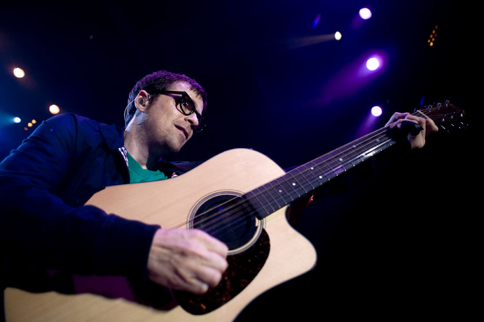 Weezer's Rivers Cuomo leads over the front edge of the stage during a performance on Saturday, Sept. 25, 2010, at Bradley University.