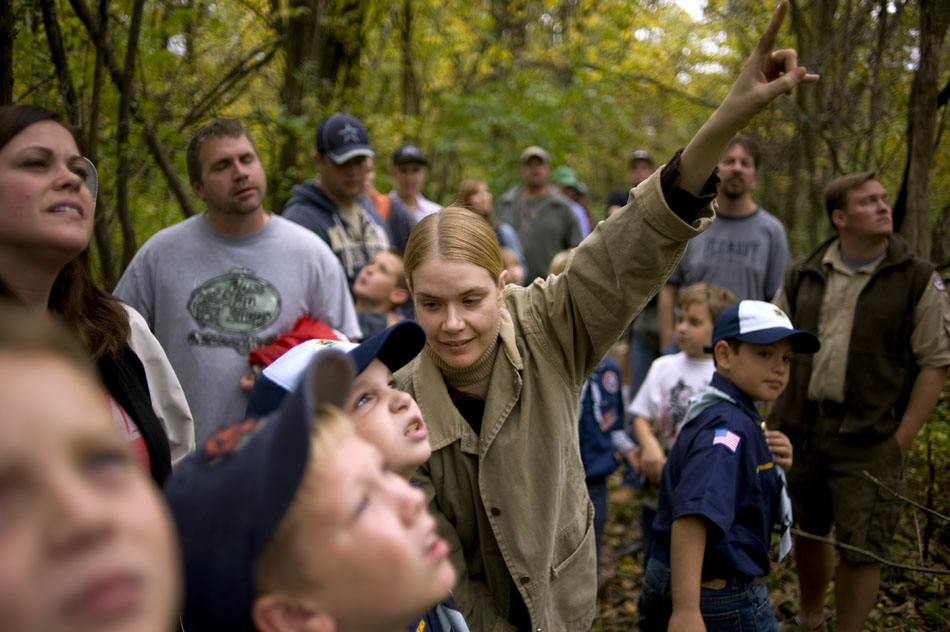 Naturalist Christine Kiefer, middle, points out a squirrel's tree-top nest to a group of Cub Scouts during a fall color walk on Sunday, Oct. 24, 2010, at the Forest Park Nature Center.
