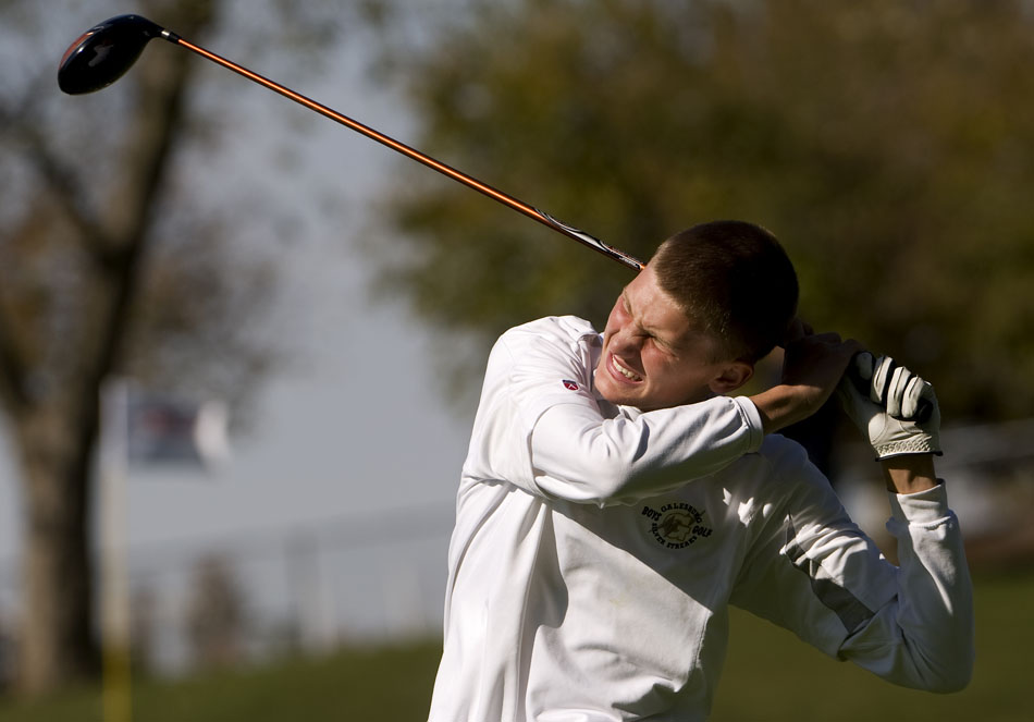 Galesburg High School senior Logan Scott grimaces as he follows through after his tee shot on the 14th hole during the IHSA Boys Golf State Championship on Saturday, Oct. 16, 2010, at the Weibring Golf Club in Normal, Ill. Scott landed the shot right of the fairway near some trees.