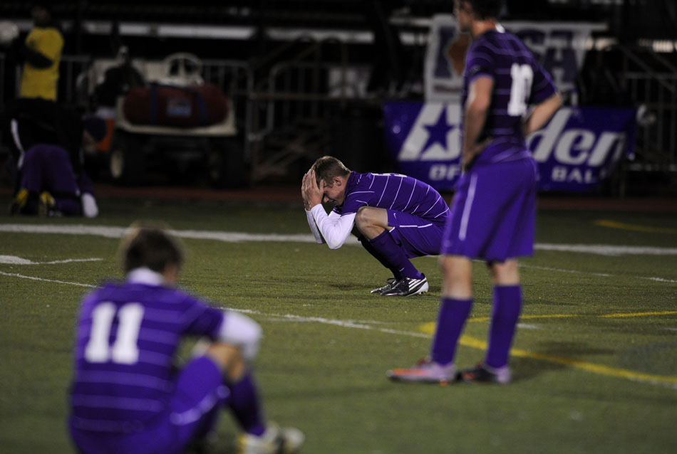 Peoria Christian junior Christian Lewis, middle, reacts after a 1-0 loss to Lisle in the state championship game on Saturday, Oct. 30, 2010, in Naperville.