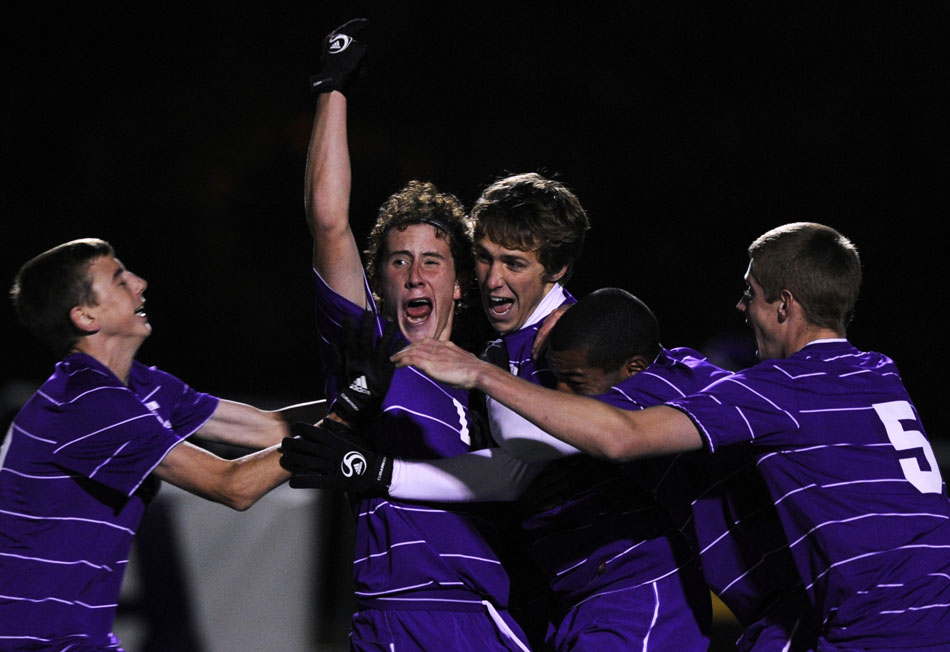 Peoria Christian players celebrate a goal by Dylan Schwartz in the 46th minute of the state semi-final on Friday, Oct. 29, 2010, in Naperville. Peoria Christian won and will play Lisle for the Class 1A state championship on Saturday night.
