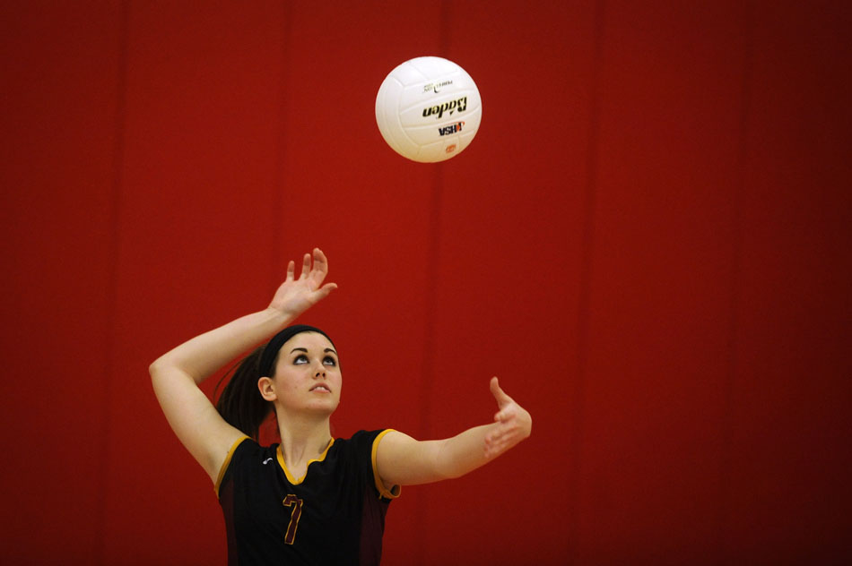East Peoria's Allison Schartman keeps an eye on the ball as she prepares to send it sailing over the net on a serve during the Class 3A regional semi-final on Thursday, Oct. 28, 2010, in Morton. East Peoria won.