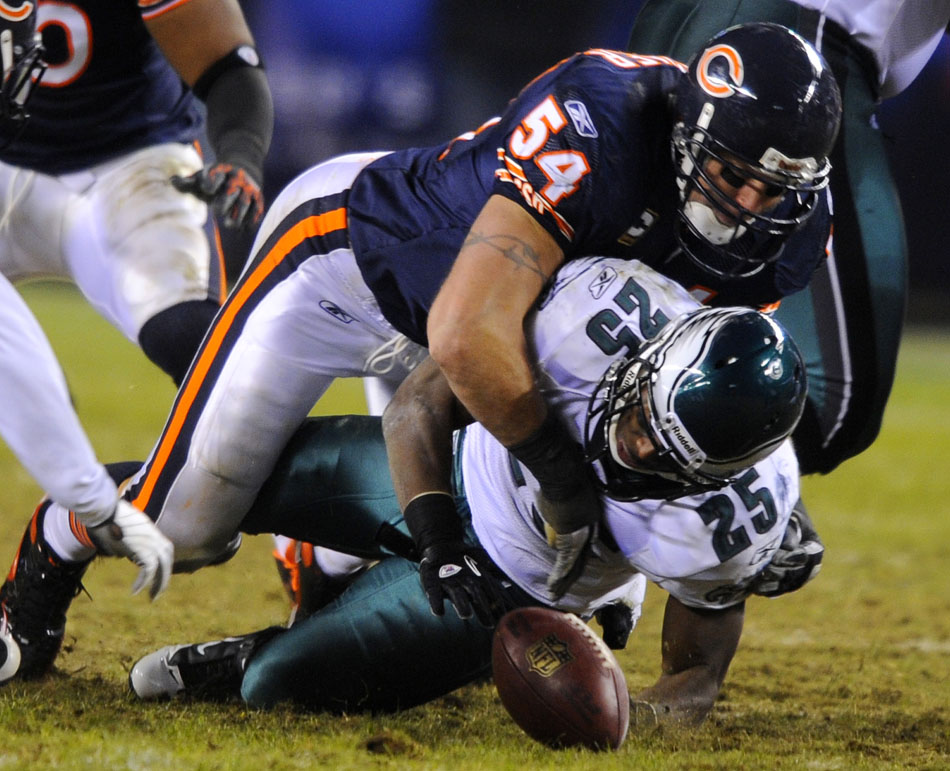 Philadelphia Eagles running back LeSean McCoy (25) fumbles the ball after a hit from Chicago Bears linebacker Brian Urlacher (54) during a game on Sunday, Nov. 28, 2010, at Soldier Field in Chicago.