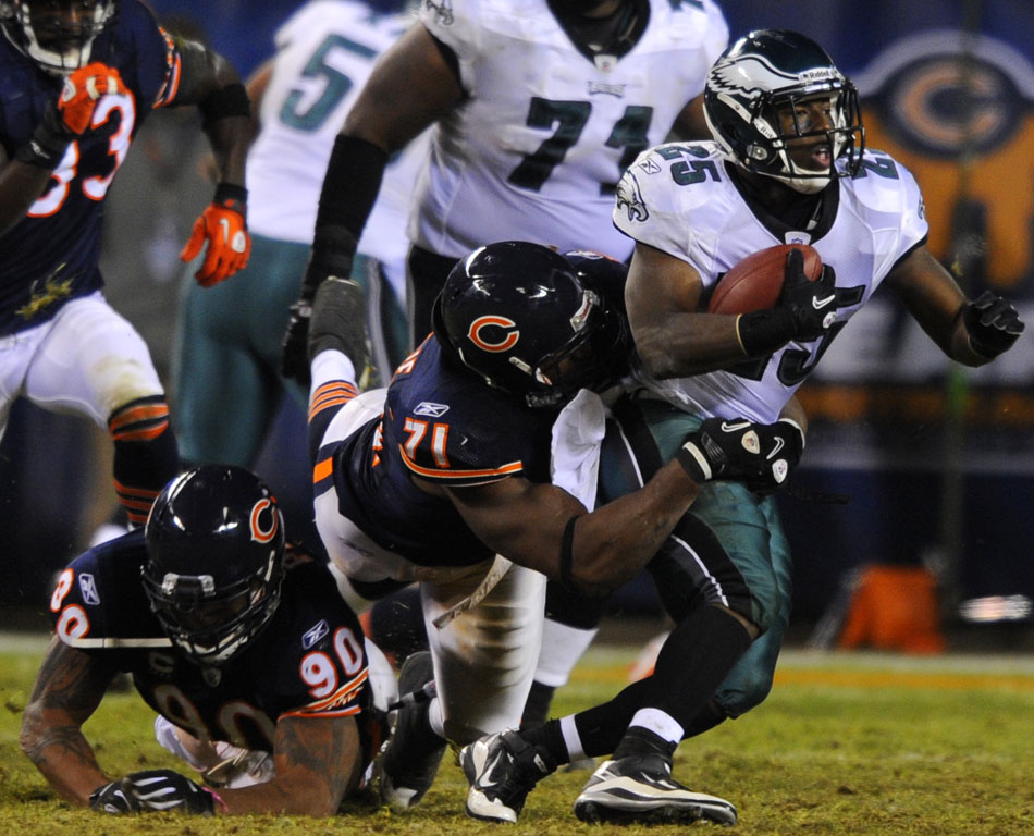 Chicago Bears defensive tackle Israel Idonije (71) tackles Philadelphia Eagles running back LeSean McCoy (25) during a game on Sunday, Nov. 28, 2010, at Soldier Field in Chicago.