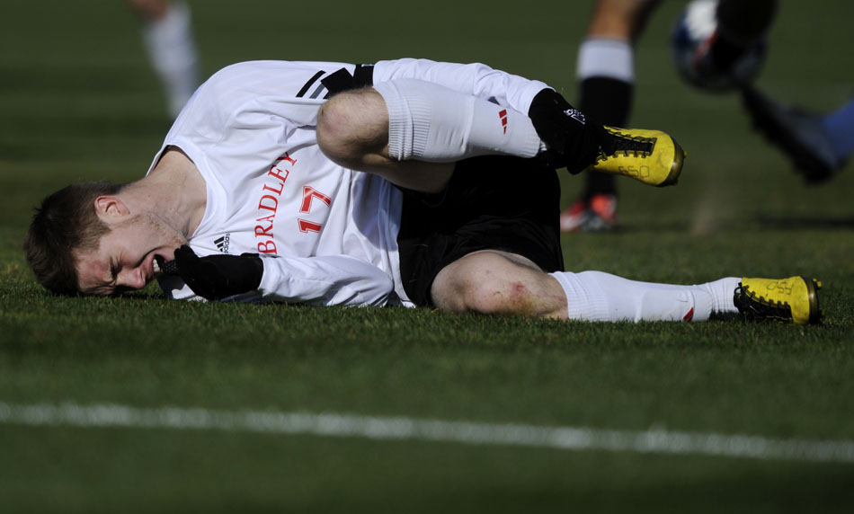 Bradley's Bryan Gaul holds his leg in pain after a collision during a game on Sunday, Nov. 14, 2010, at Shea Stadium.