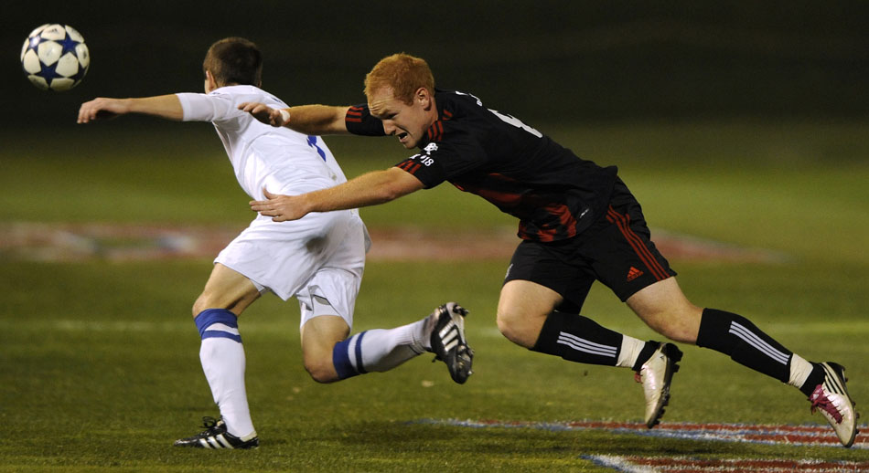 Bradley's Jochen Graf, right, falls to the pitch after making contact with Creighton's Tyler Polak during a game on Friday, Nov. 12, 2010, at Shea Stadium.