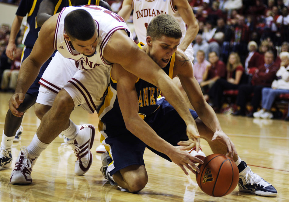 Indiana forward Bobby Capobianco, left, fights for a rebound with Franklin's Troy Porter during a game on Wednesday, Nov. 3, 2010, at Assembly Hall in Bloomington, Ind.