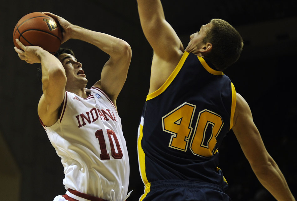 Indiana forward Will Sheehey shoots over Franklin's Will Conoley during a game on Wednesday, Nov. 3, 2010, at Assembly Hall in Bloomington, Ind.