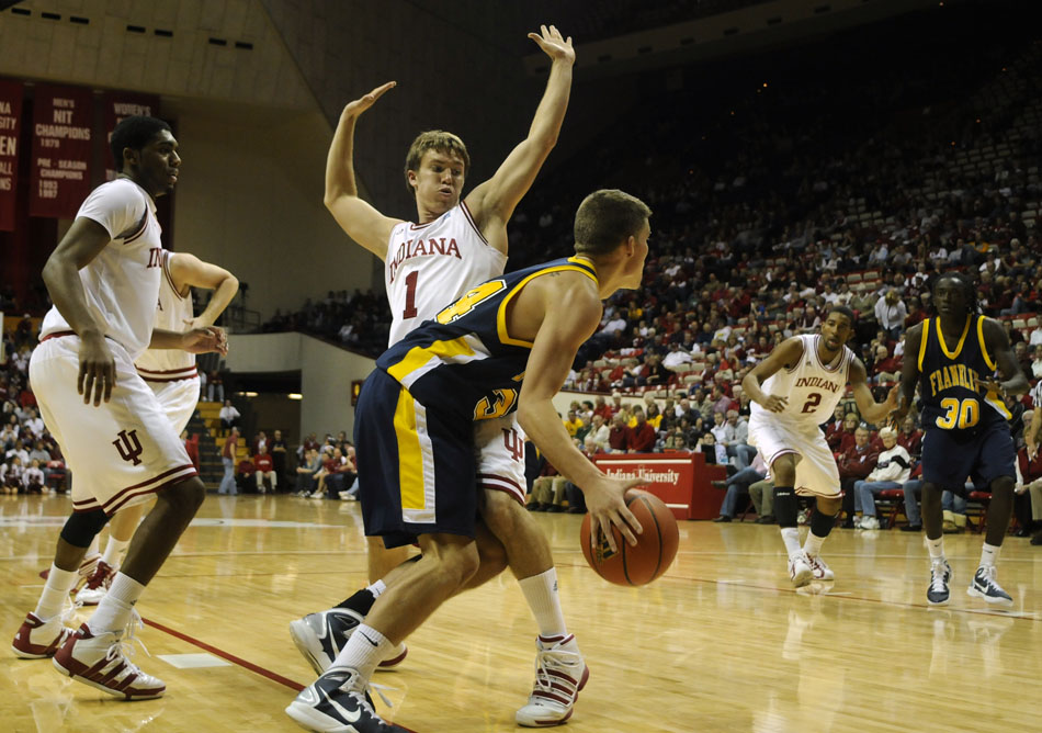 Franklin's Troy Porter drives the baseline as Indiana guard Jordan Hulls defends during a game on Wednesday, Nov. 3, 2010, at Assembly Hall in Bloomington, Ind.
