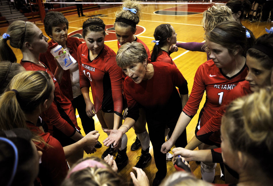 Metamora coach Karla Bartman, middle, talks to her players during a timeout in the action at the sectional championship game on Thursday, Nov. 4, 2010, in LaSalle, Ill.