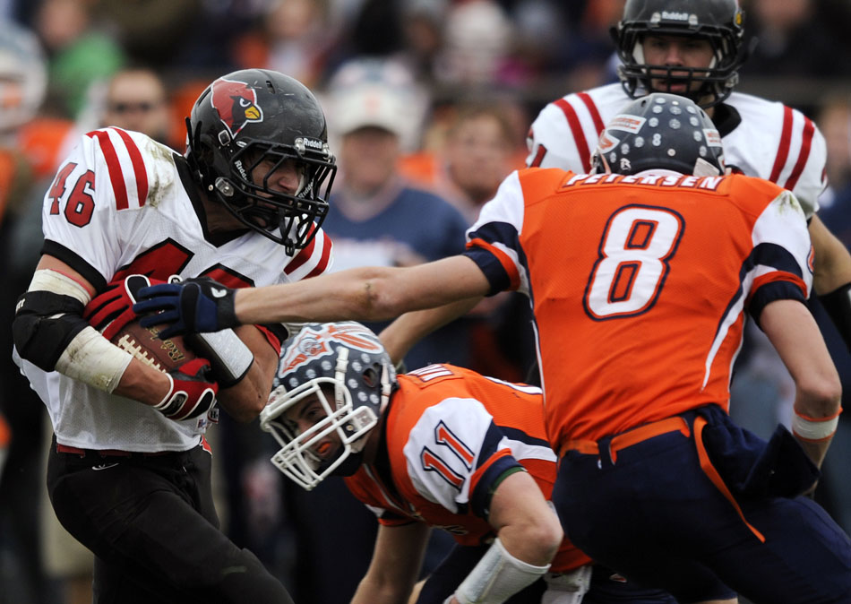 Metamora's David Tracy navigates through the Pontiac defense in the red zone during a game on Saturday, Nov. 13, 2010, in Pontiac.