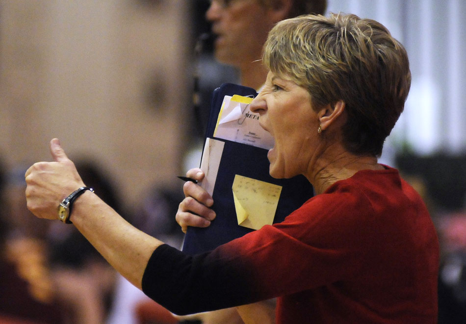 Metamora coach Karla Bartman yells in some instructions to her players before a serve during the sectional championship game against Morris on Thursday, Nov. 4, 2010, in LaSalle, Ill.
