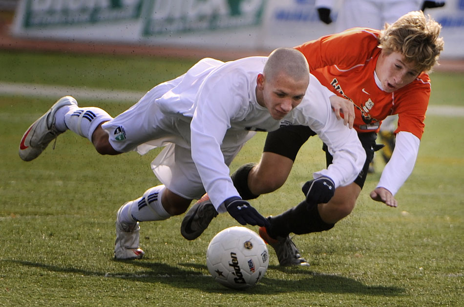 Waterloo's Kellin Daniel, right, throws Peoria Notre Dame's Kevin Whalen to the ground as they play the ball during the Class 2A semi-final on Friday,  Nov. 5, 2010, in Naperville. Notre Dame won 4-0 to advance to Saturday's state championship game.