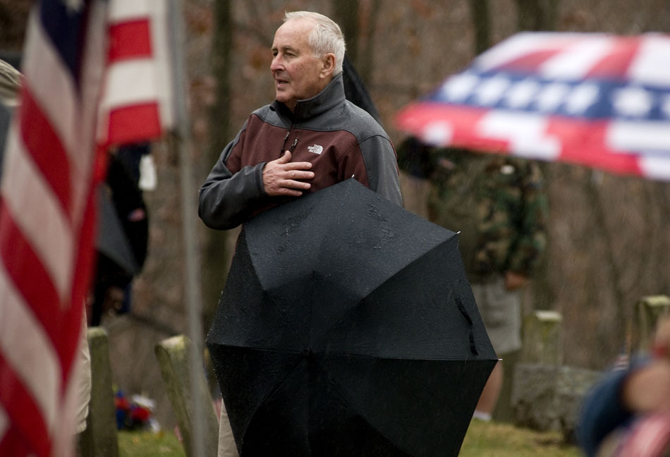 Dave Hohulin, an Amy reserve veteran, watches as the National Anthem is performed during a Veteran's Day ceremony on Thursday, Nov. 11, 2010, at Soldier's Hill in Springdale Cemetery.