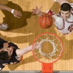 Indiana forward Bobby Capobianco, right, reaches out to grab a rebound in front of Illinois center Mike Tisdale during the second half of IU's 66-60 loss to Illinois on Saturday, Jan. 9, 2010, at Assembly Hall.