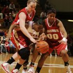 Indiana guard Jori Davis, middle, reacts after Wisconsin center Tara Steinbauer, left, and guard Jade Davis (00) strip the ball away during a game on Thursday, Jan. 28, 2010, at Assembly Hall.