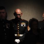 Master Gunnery Sgt. John Lund, a member of the Marine honor guard, listens to a memorial ceremony for Sgt. Jeremy McQueary on Sunday, Feb. 28, 2010, at The Seasons Lodge and Conference Center in Nashville, Ind. Lund, a veteran of the Vietnam War, Gulf War and Iraqi War, folded a flag in McQueary's ceremony. McQueary, 27, was killed in the Helmand Province in Afghanistan on Feb. 18.