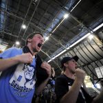 Kyle Faulker, left, and Gage Martin, both freshmen at Butler, react as they watch the closing seconds of Butler's 52-50 win against Michigan State during a watching party at Hinkle Fieldhouse in Indianapolis.