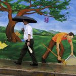 A man makes his way past a Hickory Street Bar & Grill mural in the rain on Eighth Street near the intersection of Congress Avenue in downtown Austin on Wednesday, June 9, 2010. Downtown was a sea of umbrellas as an early morning shower sent pedestrians scrambling for their rain gear to keep dry.