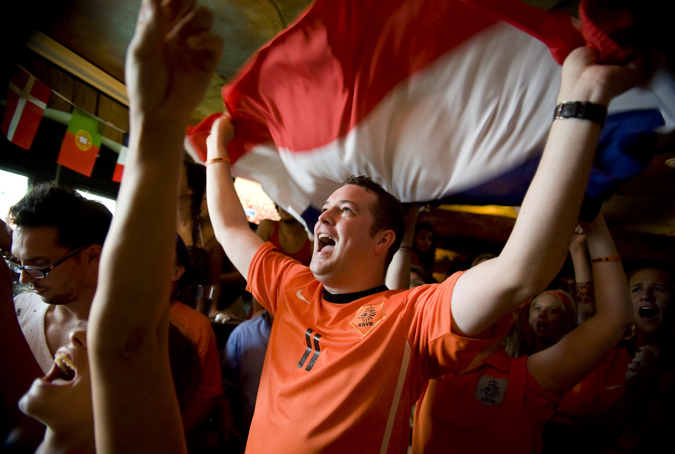 Ryan Colpaart, of Austin, cheers on the Netherlands as he watches the World Cup final from Fado Irish Pub on Sunday, July 11, 2010. Spain defeated the Netherlands 1-0 for its first World Cup title.