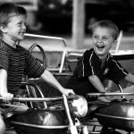 Brothers Matthew Williams, left, age 5, and Keaton Williams, age 3, share a few laughs as they ride motorcycles and honk the horns on a ride on Thursday, Sept. 9, 2010, at the Fall Festival in Elmwood, Ill.