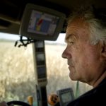 Mike Schachtrup watches out the windshield as he combines a field of corn on Monday, Oct. 11, 2010, near the intersection of Alta Lane and Radnor Road. Schachtrup farms about 6,000 acres in Peoria, Tazewell, Knox and Warren counties with his brothers including this 70-acre field northwest of Peoria.