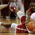 Bradley's Dyricus Simms-Edwards tries to flip the ball to a teammate as Charonn Woods wrestles for the ball during the red and white scrimmage on Sunday, Oct. 24, 2010, at the Renaissance Coliseum.