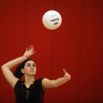 East Peoria's Allison Schartman keeps an eye on the ball as she prepares to send it sailing over the net on a serve during the Class 3A regional semi-final on Thursday, Oct. 28, 2010, in Morton. East Peoria won.