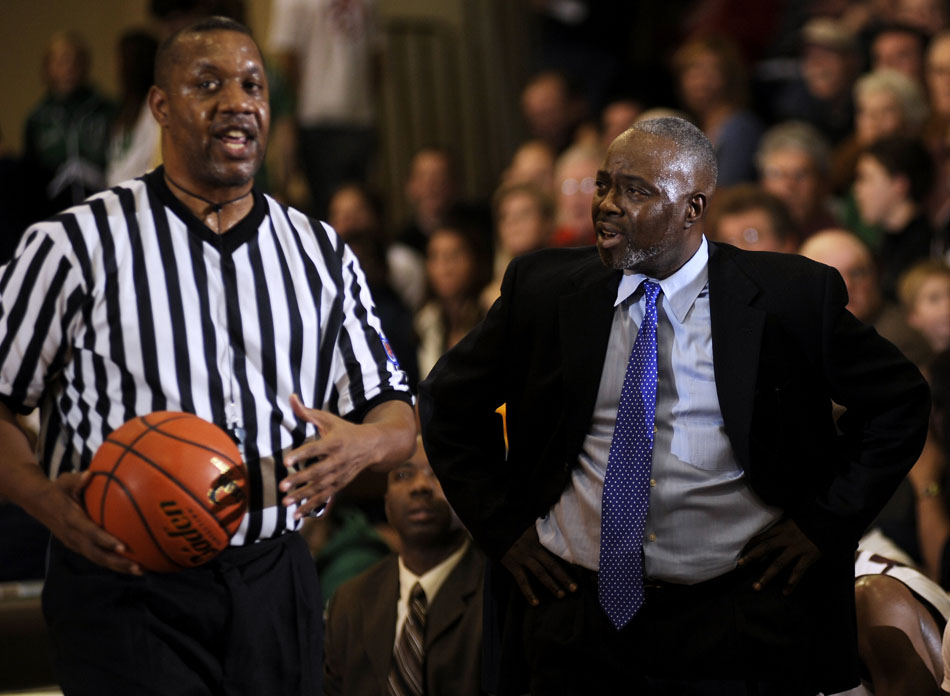 Central coach Dan Ruffin, right, has words with an official during a game on Friday, Dec. 17, 2010, at Peoria High School.