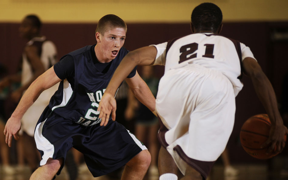 Notre Dame's Brett Lane (22) defends Centrals Sterling Jackson during a game on Friday, Dec. 17, 2010, at Peoria High School.