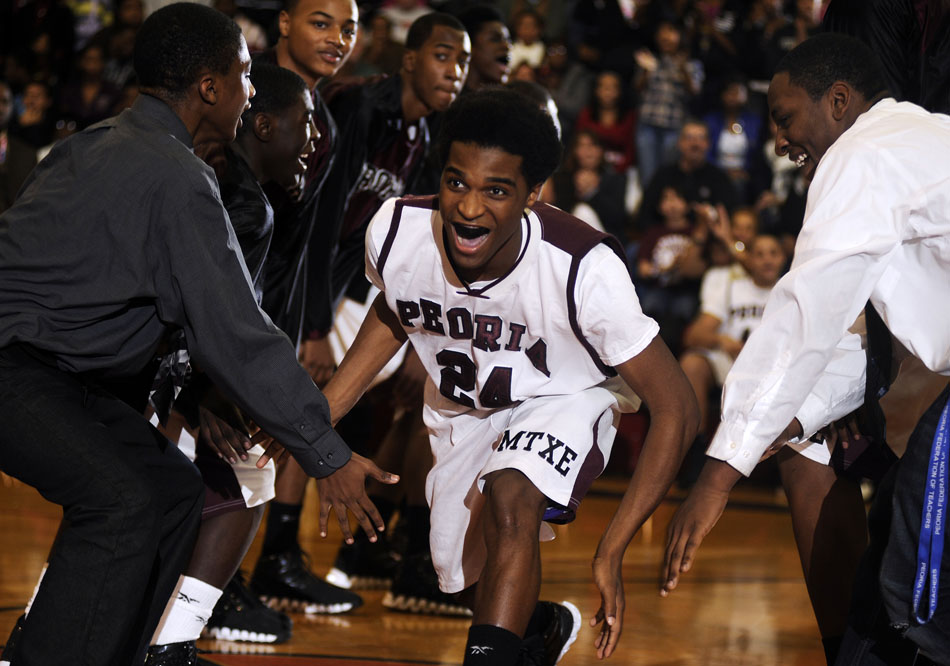 Central's Deontray Dorsey (24) reacts as he is introduced in the starting line up during a game on Friday, Dec. 17, 2010, at Peoria High School.