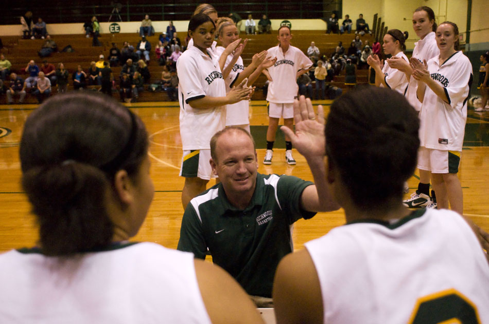 Richwoods coach Todd Hursey high fives one of his players before a game against Morton on Thursday, Dec. 2, 2010, at Richwoods High School.