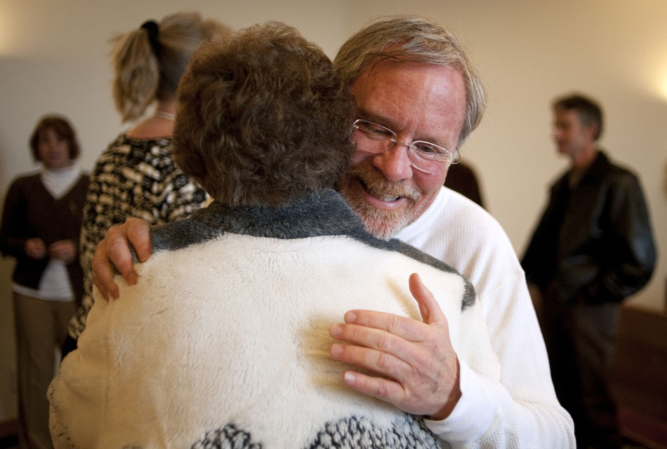 The Rev. Rodger McDaniel hugs a member of his congregation after a sermon on Sunday, Jan. 16, 2011, at the Highlands United Presbyterian Church. McDaniel, who retired from a government position, lived homeless for a week as he transitioned into retirement.