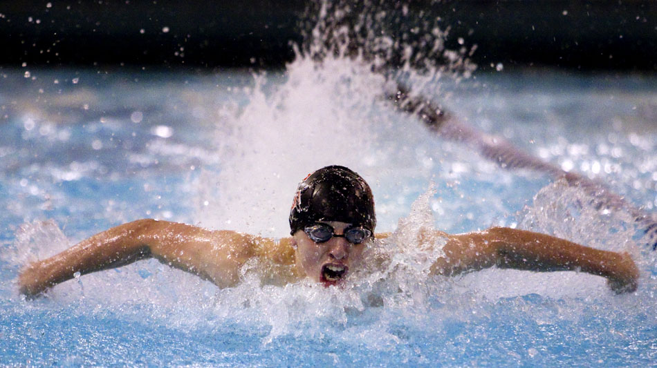 Central's Garrett Koehler swims in a heat for the 200 yard intermediate medley during a East-Central boy's swim meet on Tuesday, Jan. 18, 2011, at East.