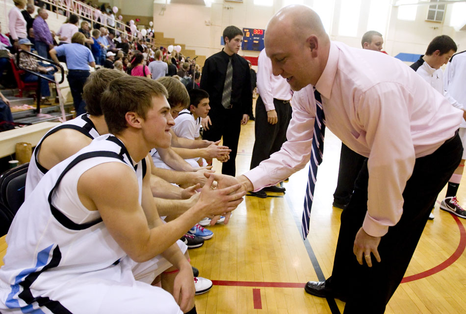 Cheyenne East coach Zane Jacobsen gets Jordon Mossey, left, pumped before the start of a game against Central on Saturday, Jan. 22, 2011, at Storey Gym.
