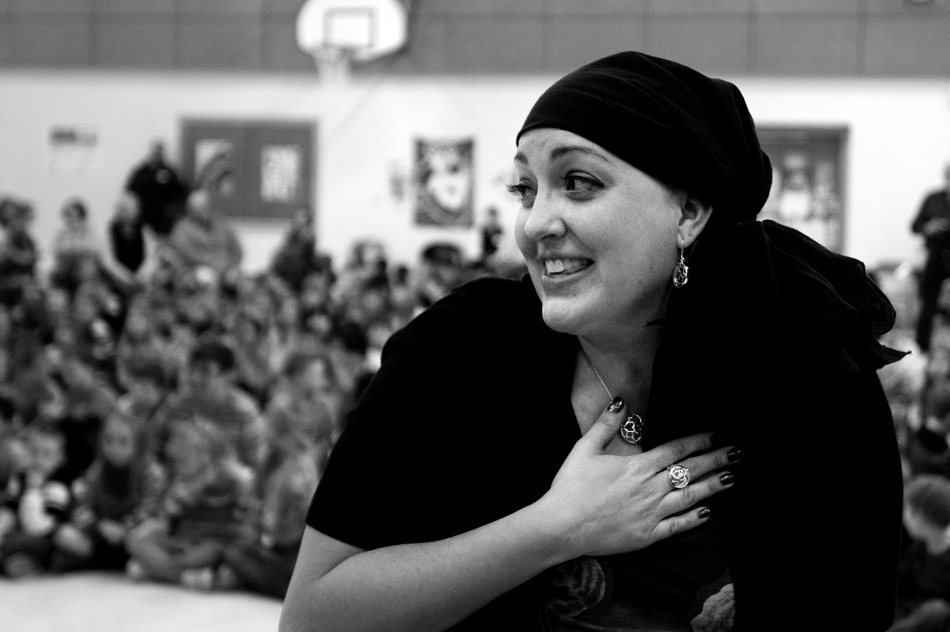 Sunrise Elementary teacher Heather Blakely-Voyles talks with students as they donate part of her hair to Locks of Love during a student assembly on Friday, Jan. 28, 2011, at the school. Three students donated hair in honor of Blakely-Voyles, who has taken a leave of absence from the school as she battles cancer.