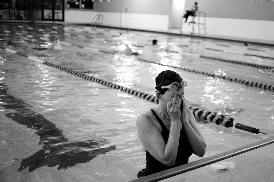 Sharlee Davis wipes water out of her eyes after swimming a mile on Saturday, Feb. 27, 2010, at the Monroe County YMCA. Davis says it takes her around 40 minutes to swim a mile in the pool, an activity she does three to four times a week.
