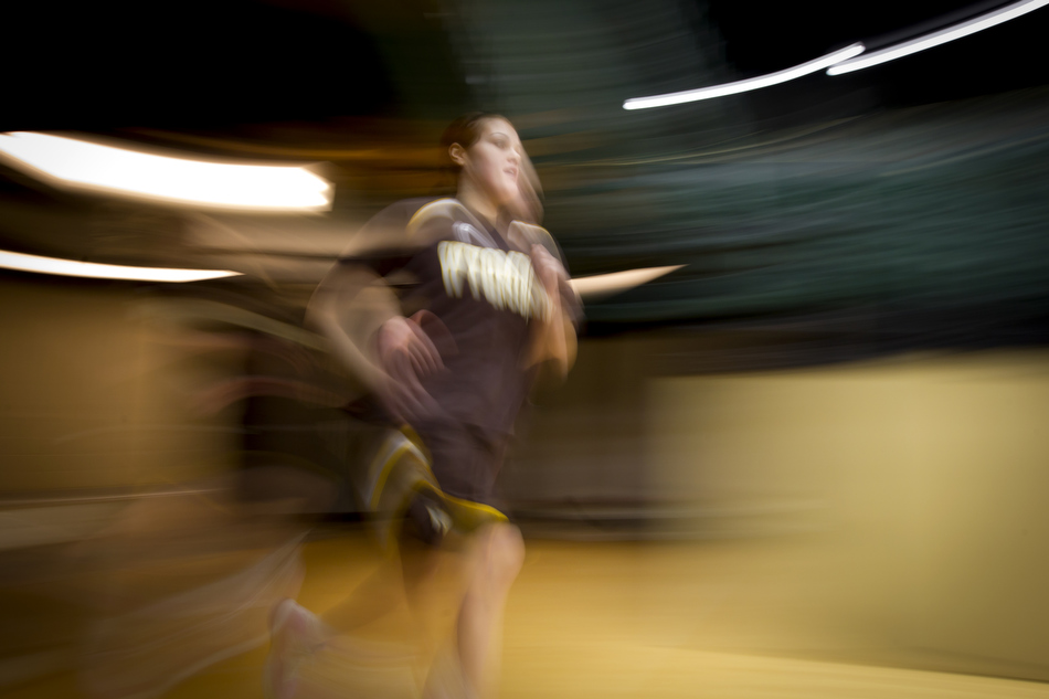 Wyoming forward Jade Kennedy (14) runs onto the court with her teammates before the start of a game against Colorado State on Saturday, Feb. 5, 2011, in Fort Collins. 