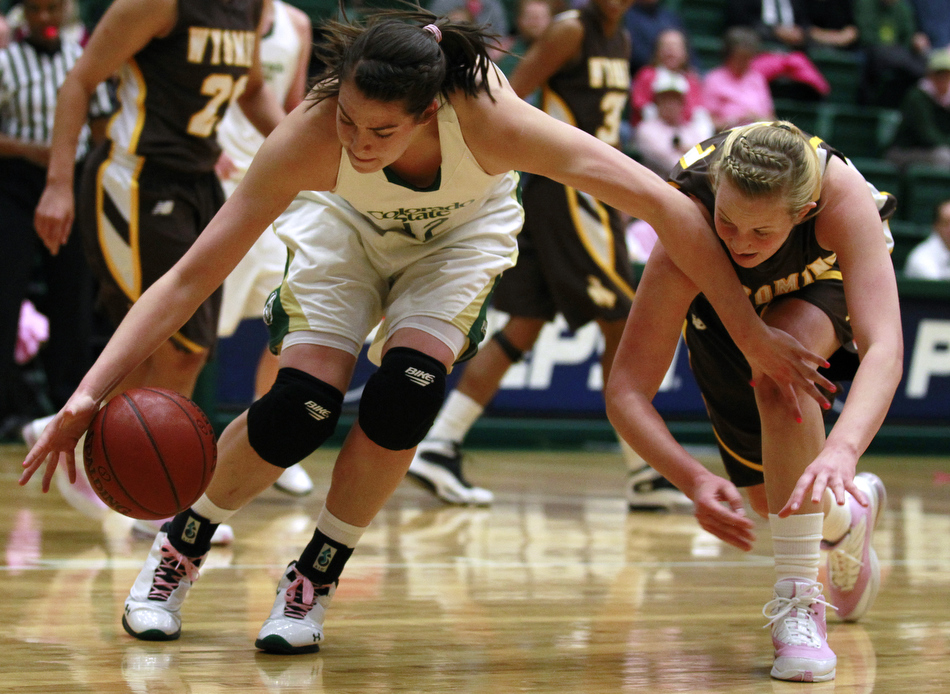 Colorado State forward Sam Martin, left, battles Wyoming forward Hillary Carlson (41) for a loose ball during a game on Saturday, Feb. 5, 2011, in Fort Collins.