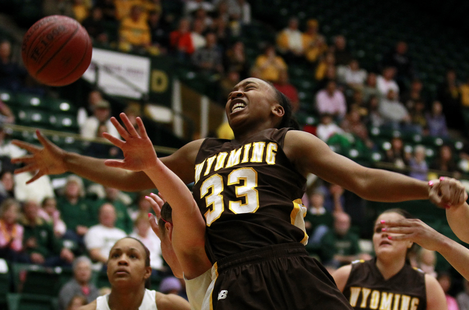 Wyoming forward Chaundra Sewell (33) reacts as a Colorado State defender strips the ball away from her during a game on Saturday, Feb. 5, 2011, in Fort Collins.