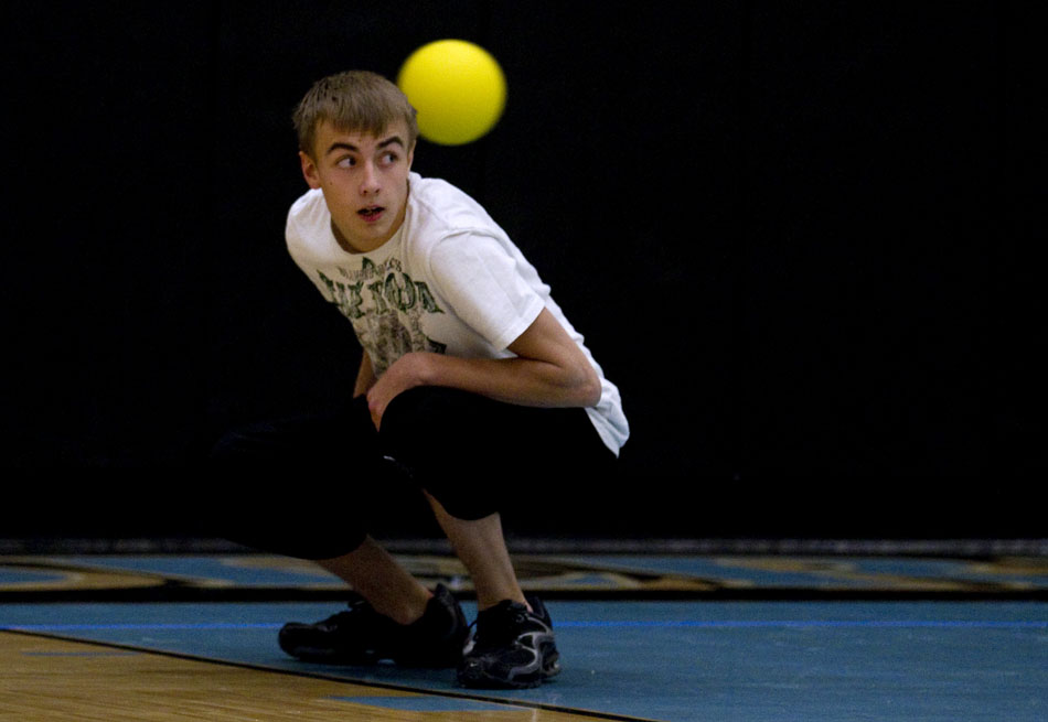 Jamie Hooks, a sophomore at East, ducks during a game of charity dodgeball on Tuesday, Feb. 8, 2011, at the school. Hooks was the last person left on his team, the Hello Goodbyes.