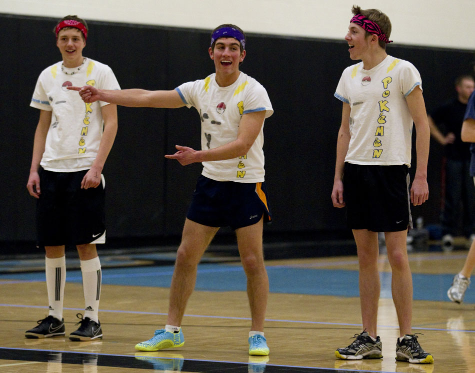 Sindre Solvang, left, Spencer Maul and Alex Vernon, all members of the Pokemen team, give instructions to teammates during a charity dodgeball tournament on Tuesday, Feb. 8, 2011, at East High School. The tournament benefited the Denver Children's Miracle Network.