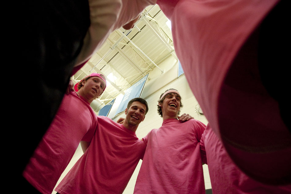 Six and the Pink players react as they listen to a humorous, but yet inspirational speech from their coach before a game during a charity dodgeball tournament on Tuesday, Feb. 8, 2011, at East High School. The tournament benefited the Denver Children's Miracle Network.