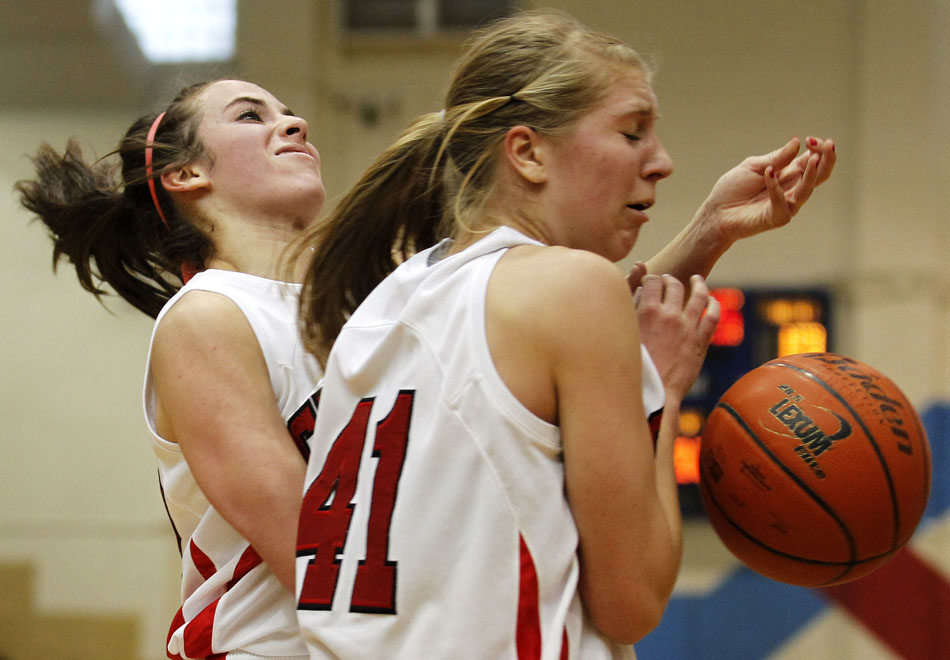 Central's Makena Cameron, left, looses the ball as she collides with teammate Christie Schiel (41) during a game on Saturday, Feb. 12, 2011, at Storey Gym in Cheyenne. Central won 59-51.
