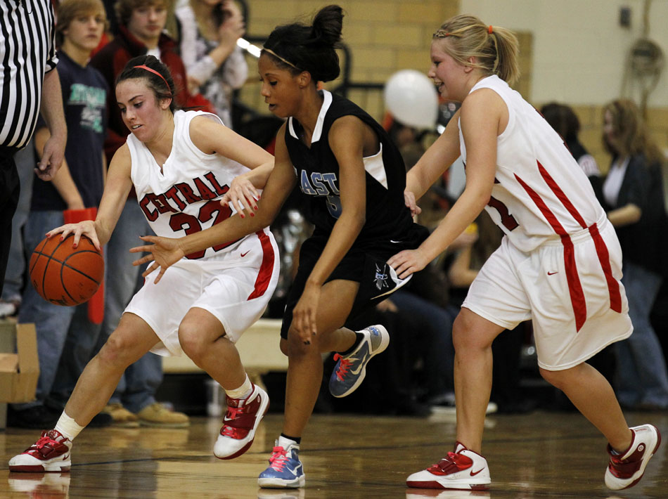 Central's Makena Cameron, left, tracks the ball down after East's Destiny Rudolph attempted to make a steal during a game on Saturday, Feb. 12, 2011, at Storey Gym in Cheyenne. Central won 59-51.